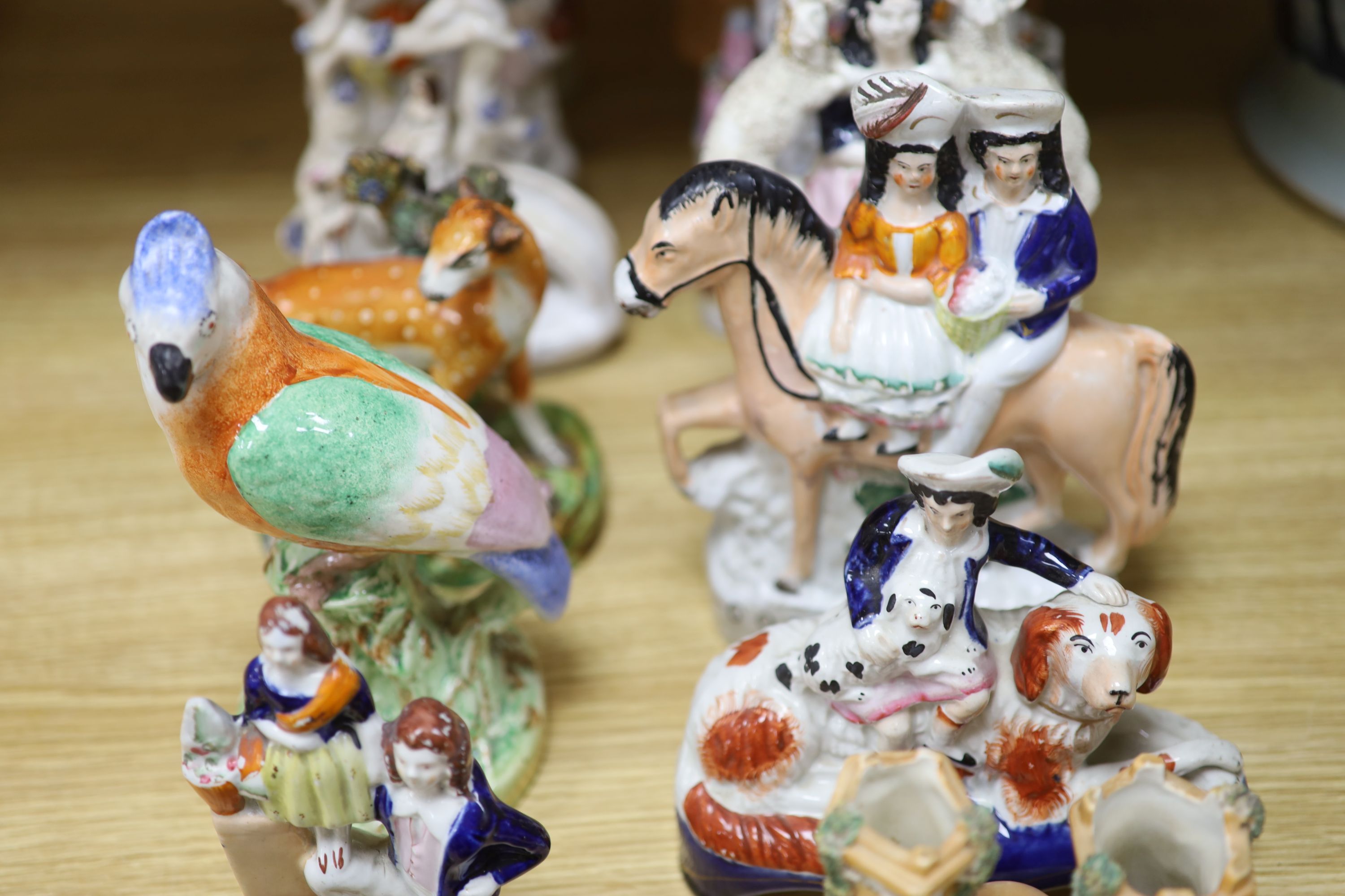 A collection of assorted Staffordshire figures and sundry ceramics including early 19th century Staffordshire pearlware deer, tallest 3